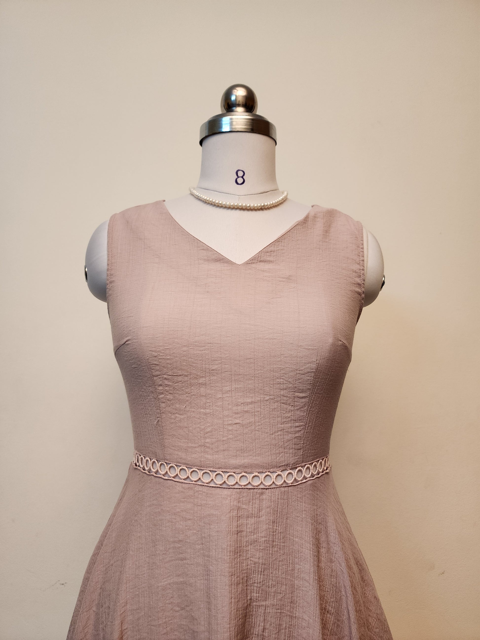 Elegant Blush Pink V-Neck Midi Dress with Textured Fabric